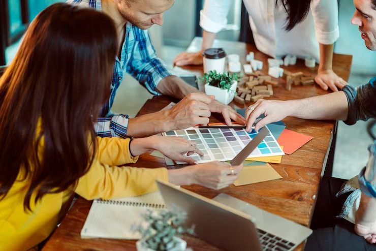 creative business meeting with caucasian asian worker discuss with paper laptop happiness joyful cafe background
